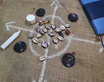 Divination tools, cowrie shells and coconut shells